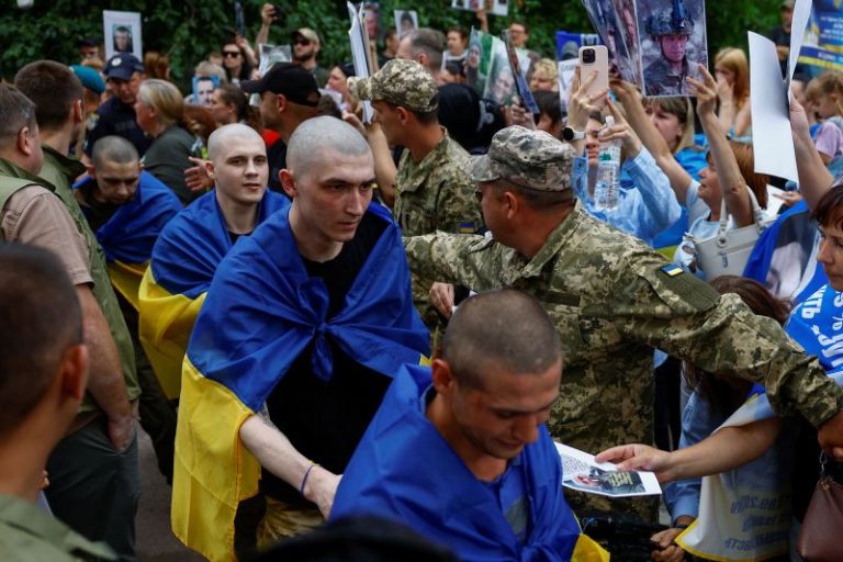Soldiers return home after years in captivity as Ukraine-Russia prisoner swap begins